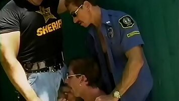 Two jacked gay cops and a hot perp get some sucking outside